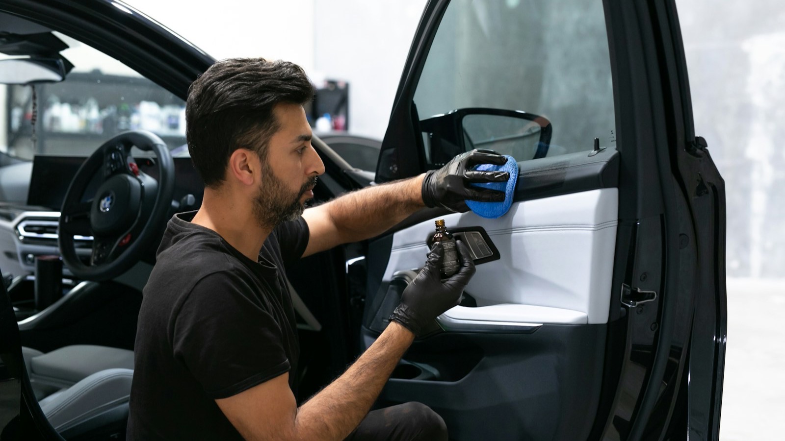 A vehicle door panel receiving careful interior attention
